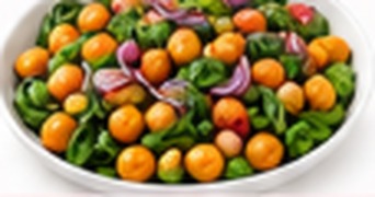 Salade tiède de pois chiches, épinards, patate douce & oignon rouge